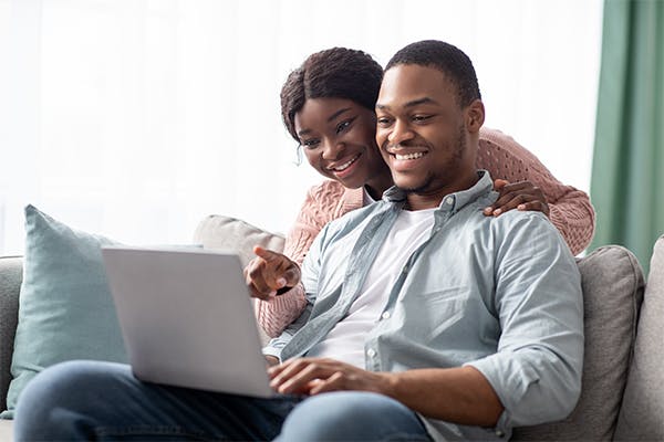 https://tower.toptrustedfunds.com/wp-content/uploads/2023/01/Closeup-of-cheerful-black-couple-using-laptop-.jpg